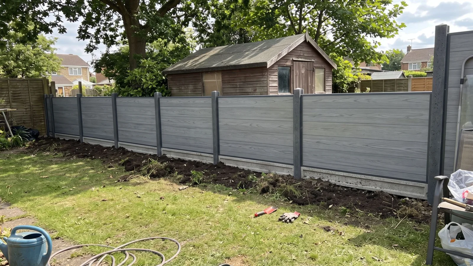 Composite privacy fencing with concrete gravel boards in a Bedfordshire garden